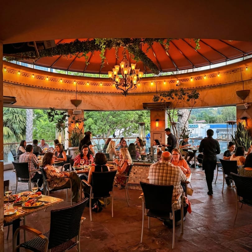 Diners enjoying Mexican food and drinks on the outdoor patio of Anejo Cantina and Grill.