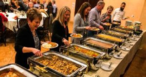 People serving themselves food at Añejo Cantina & Grill